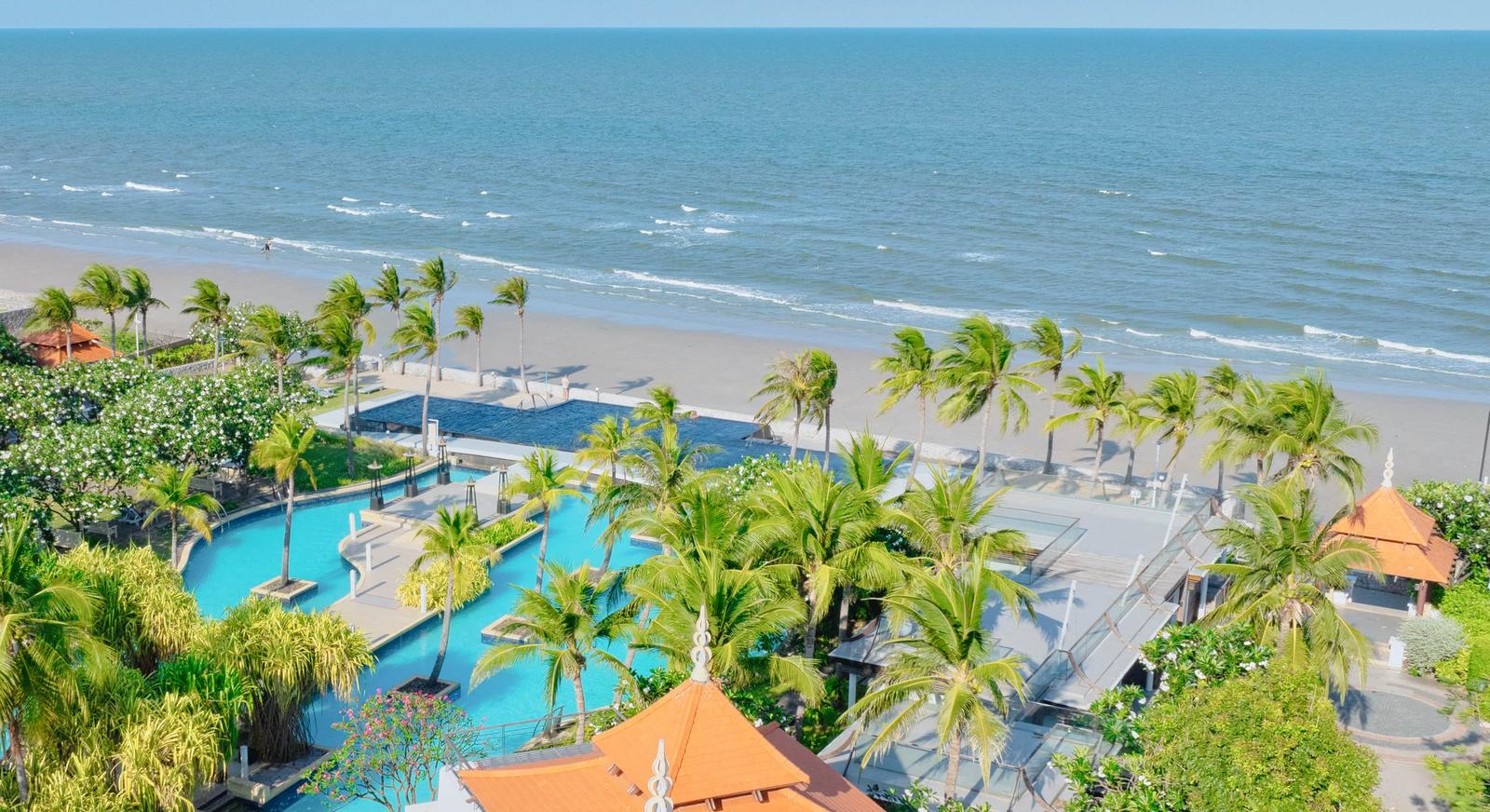 Villa Nilaya and the Boathouse Estate seen from the air, the beach and the Gulf of Thailand beyond