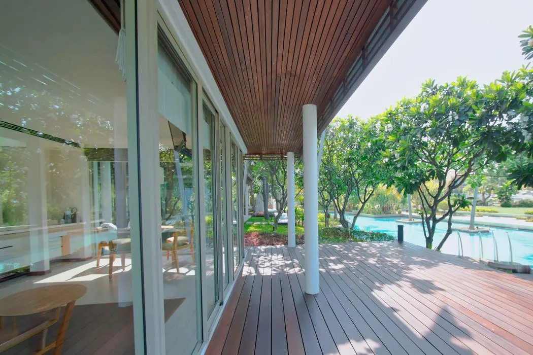 The covered timber terrace running along the Beachfront Pavilion