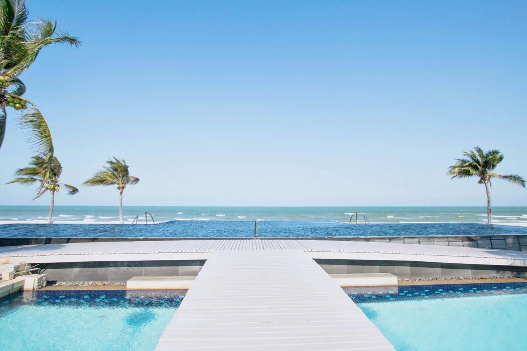 The beachfront infinity pool where it meets the sea