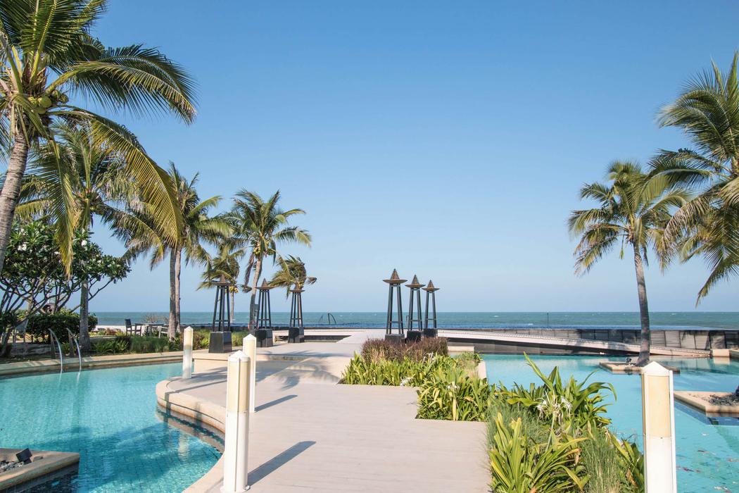 The lagoon pool and palm islands in front of the property