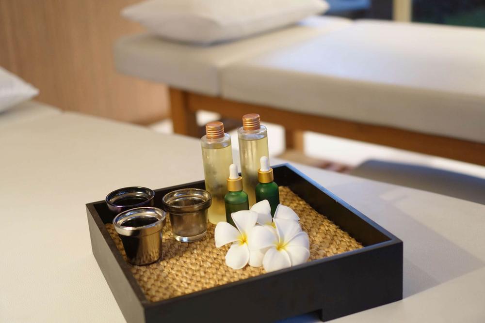 Aroma oils and frangipani on a tray in the Spa Pavilion