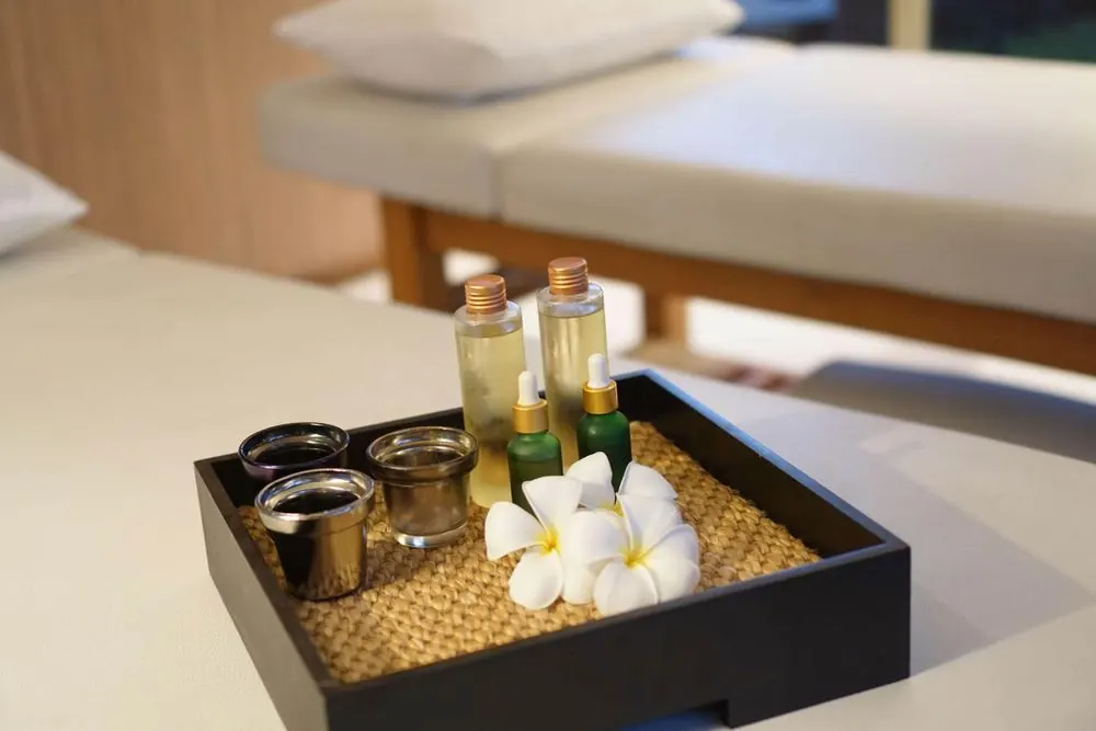Aroma oils and frangipani on a tray in the Spa Pavilion