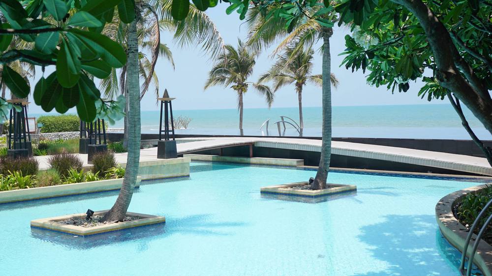 The pool running along the front of the property