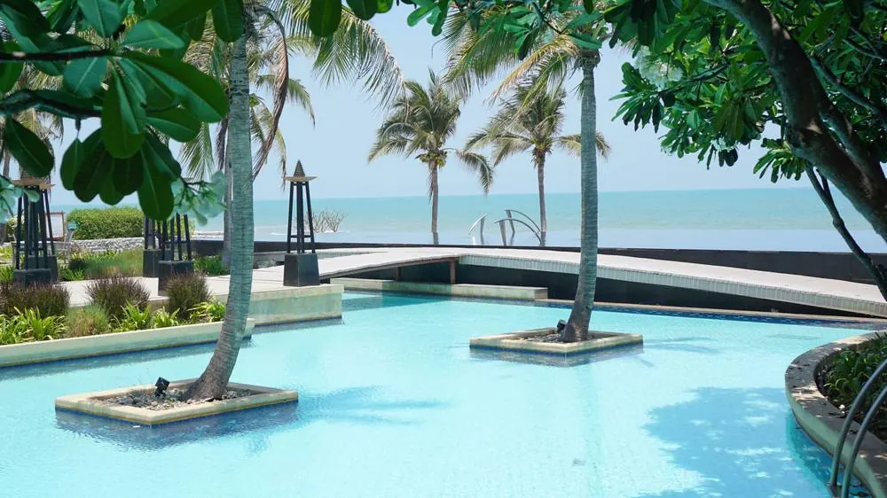 The pool running along the front of the property