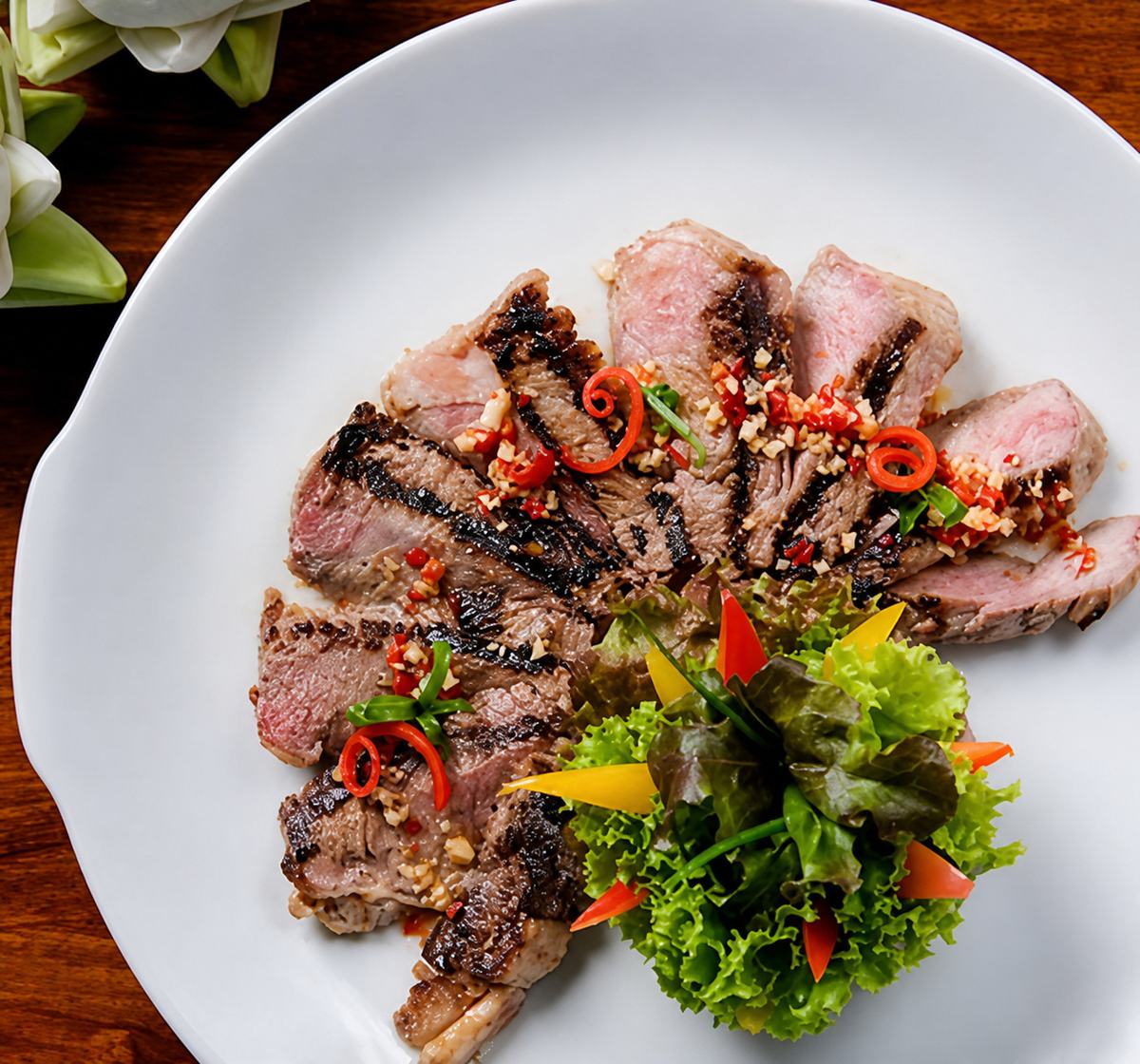 Grilled rib eye steak, sliced